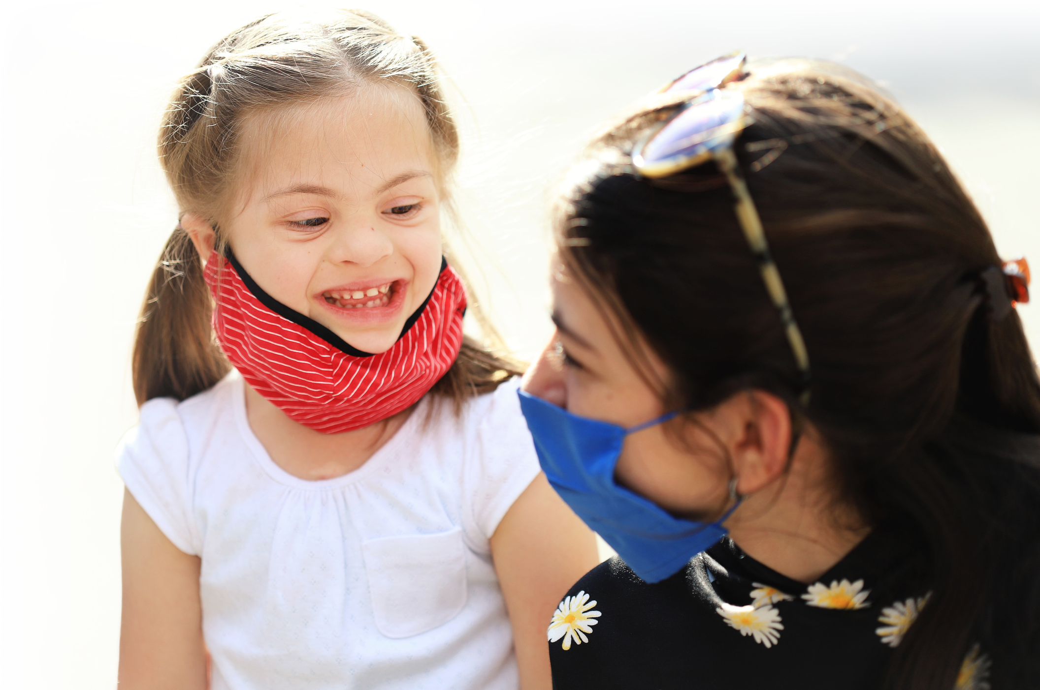 Photo of a young girl with an adult woman..