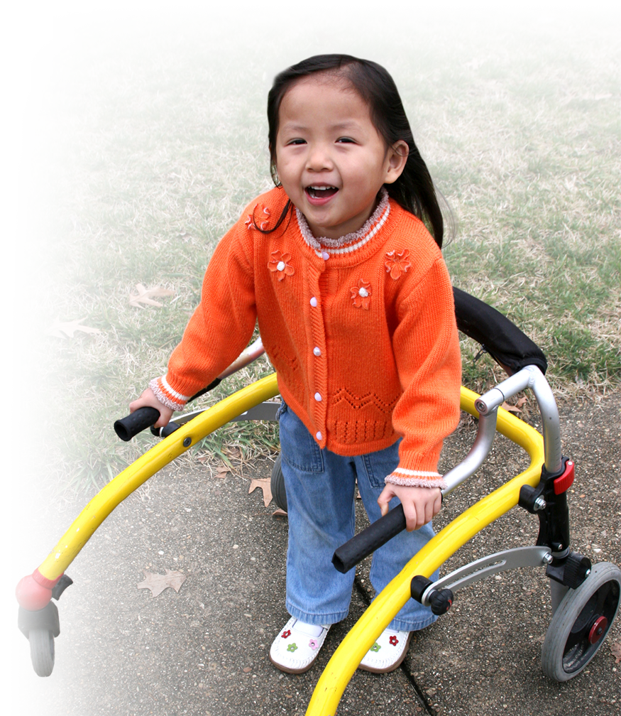 Photo of a happy young girl using a walking-assist device.